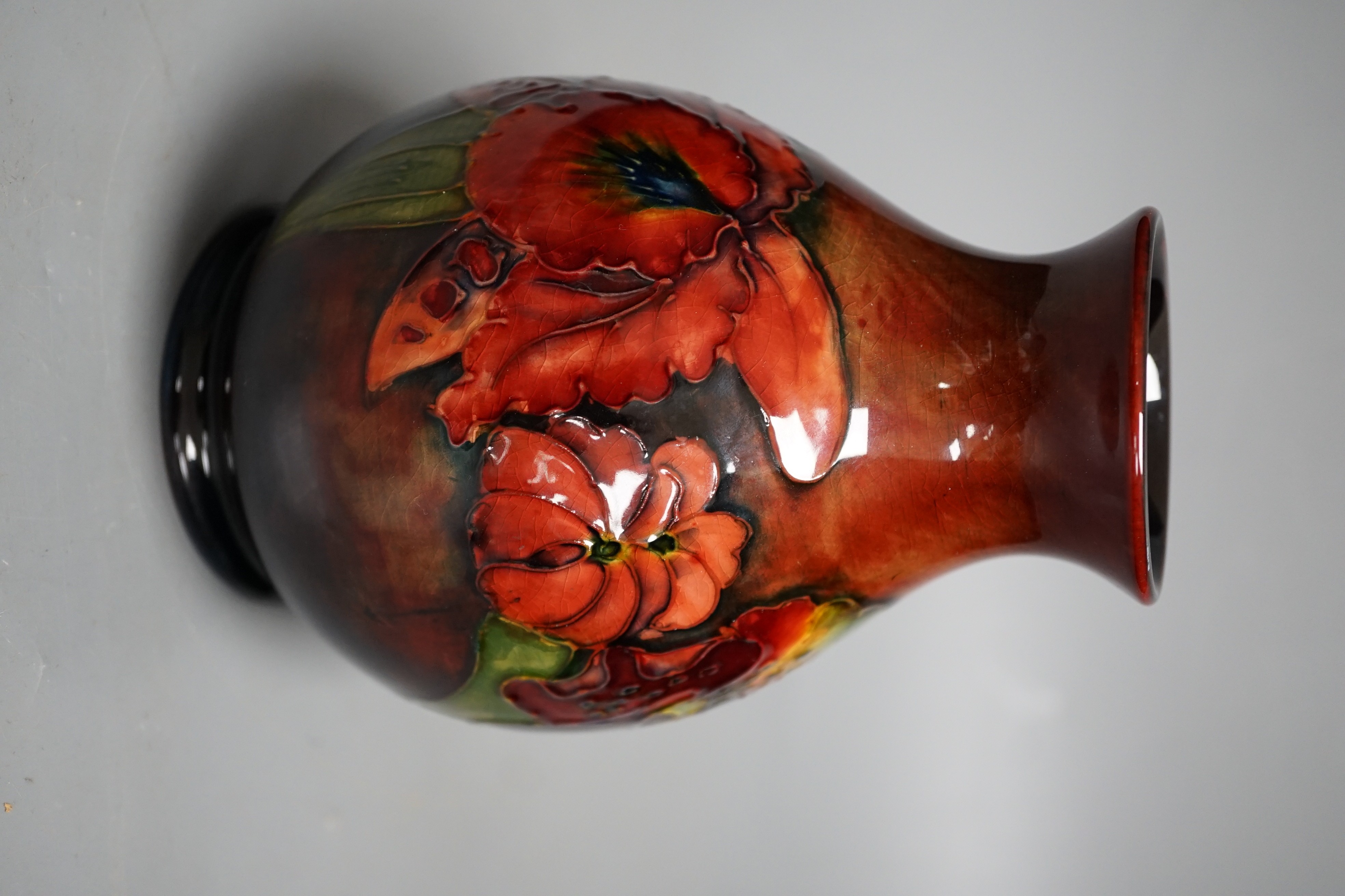 A Moorcroft flambé orchid pattern vase, 15cm